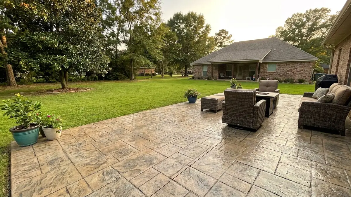 Stamped concrete patio in Pearl Mississippi Rankin County residential backyard ashlar slate pattern southern humid Marcus